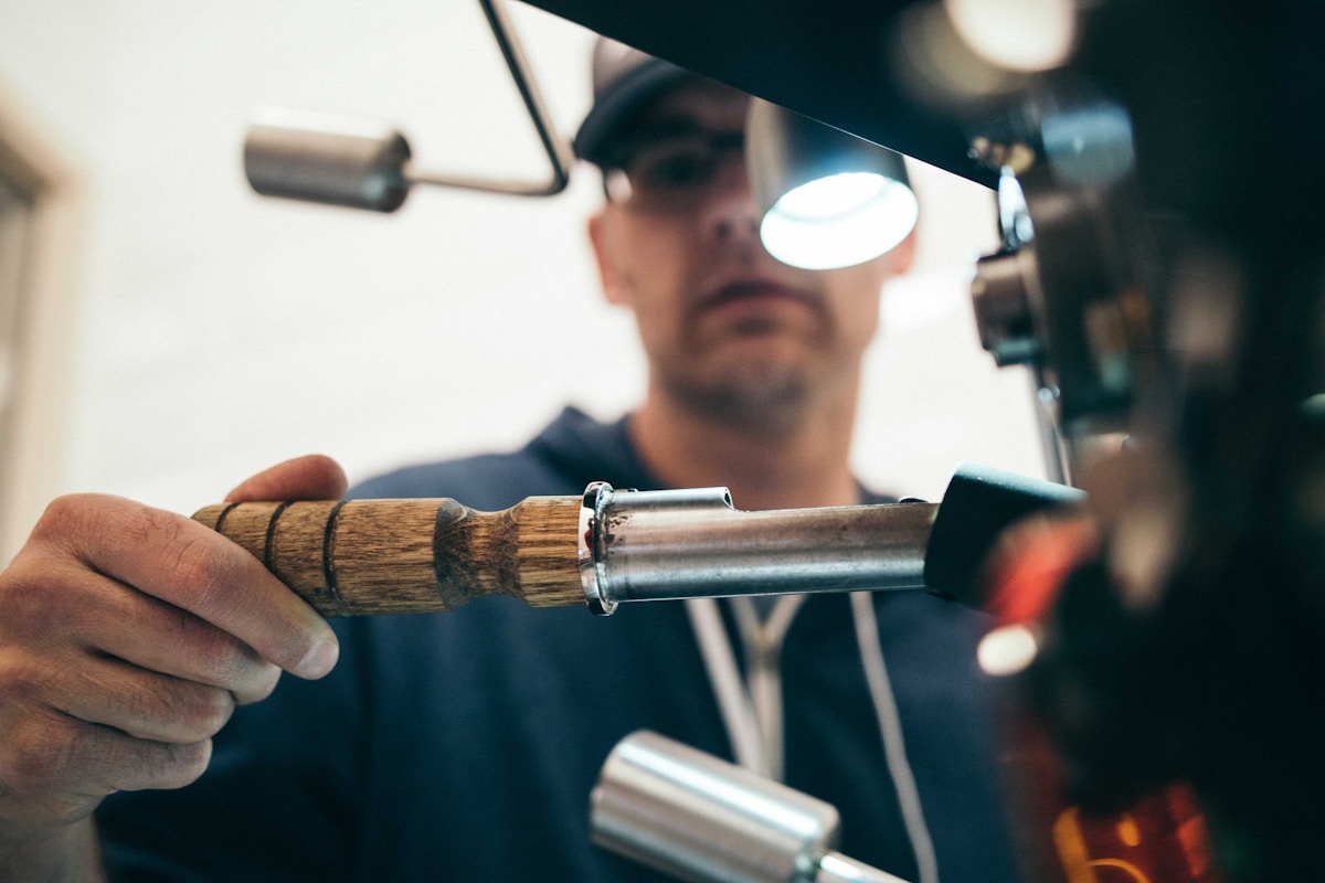 Detail technician inspecting work with professional lighting